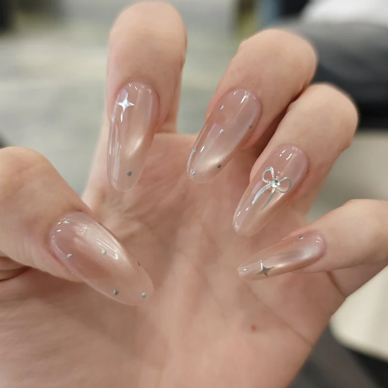 Elegant Stiletto Nail Tips with Bow Accents Stornfield