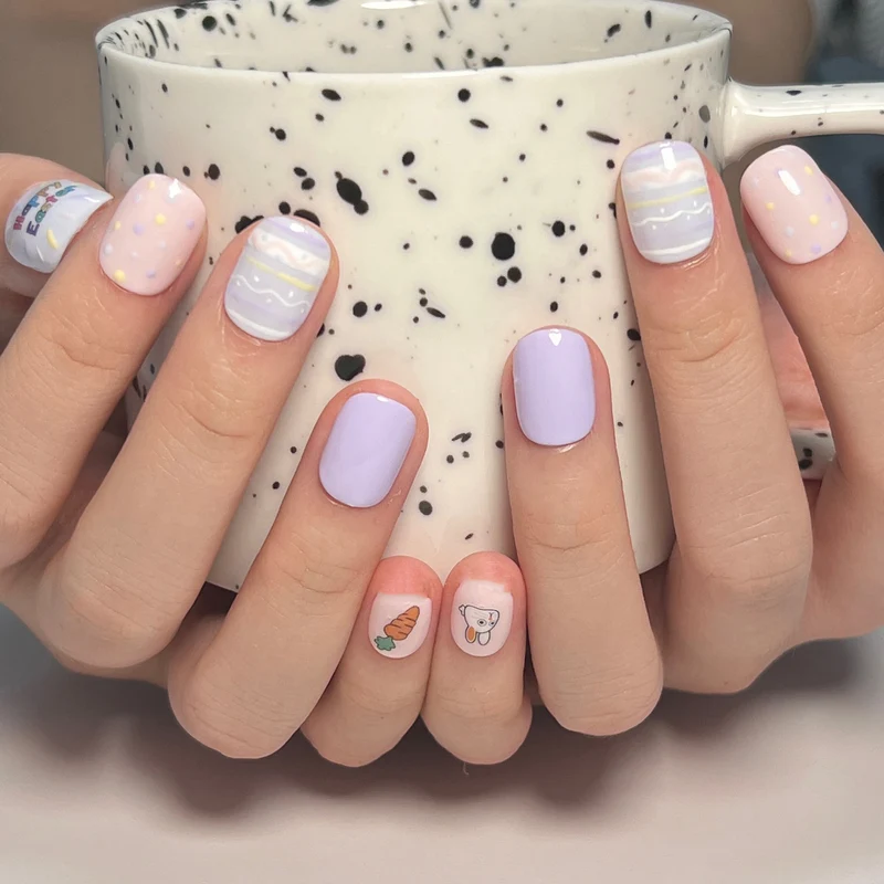 Artful nail art with cute animal motifs and pastel-colored design Stornfield