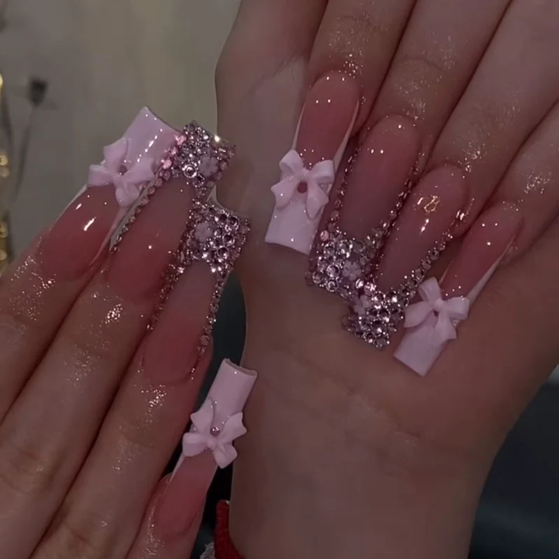 Artful Nail Art with Rhinestone Accents and Bows Stornfield