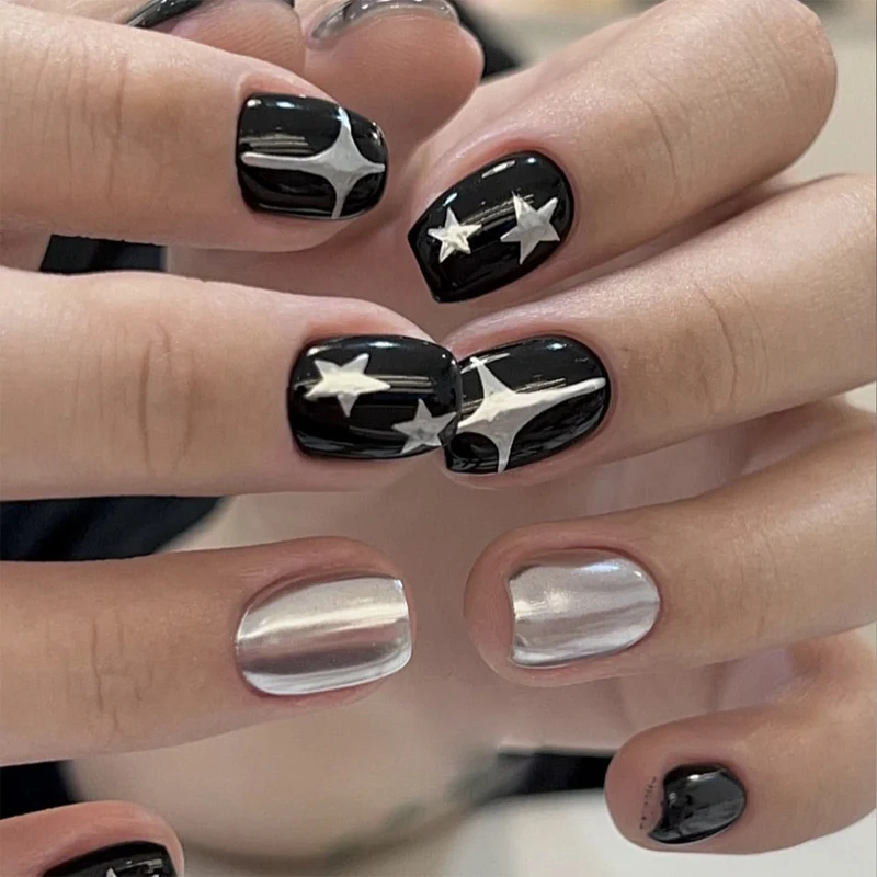 Artful Nail Art with Metallic and Star Motifs Stornfield