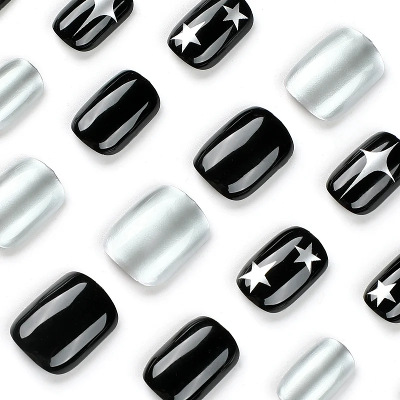 Artful Nail Art with Metallic and Star Motifs Stornfield