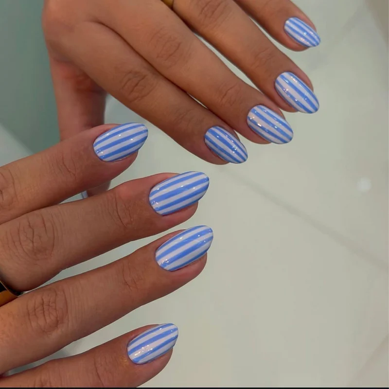 Artful nail art with maritime striped pattern Stornfield