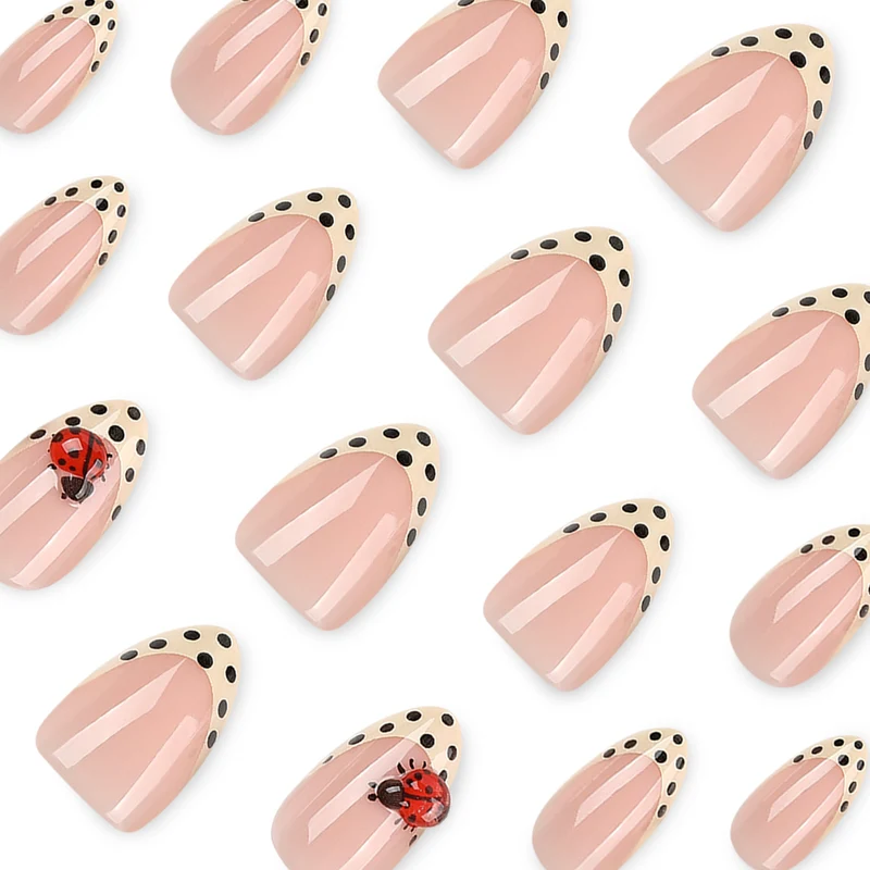 Artful nail art with ladybug motif and polka dots Stornfield
