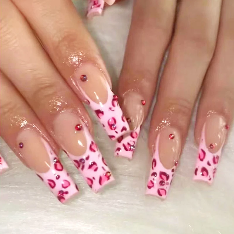 Artful nail art with leopard pattern and glitter accents Stornfield