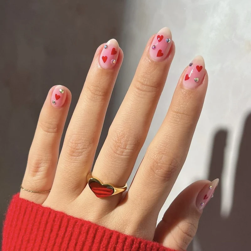 Artful nail art with heart motifs and glamorous details Stornfield