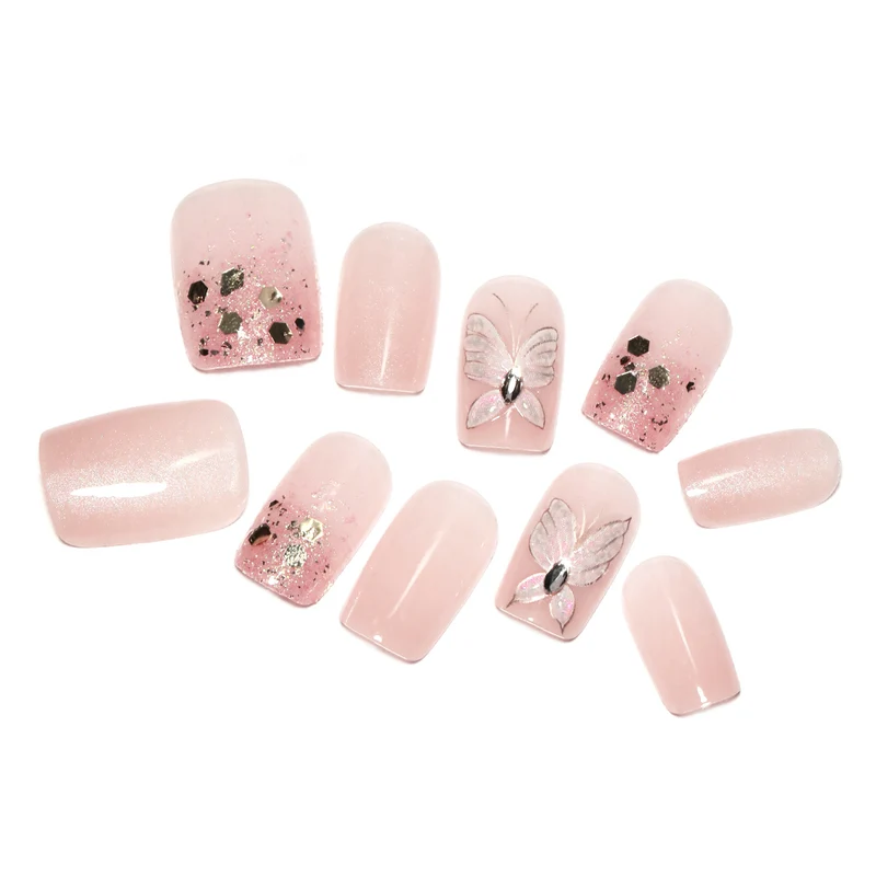 Artful nail art with butterfly designs and glitter accents Stornfield