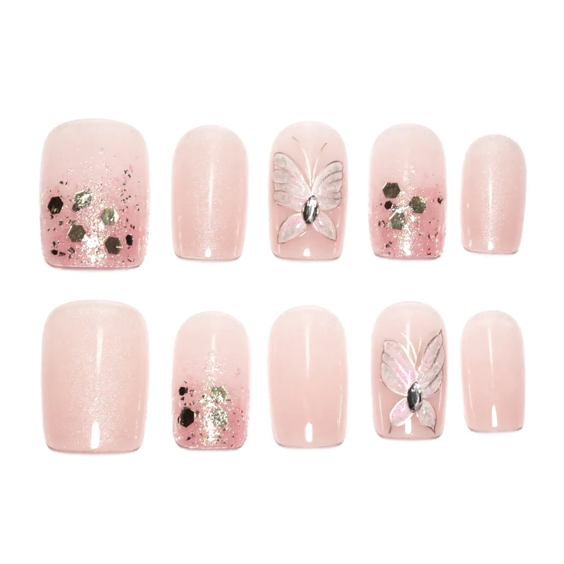 Artful nail art with butterfly designs and glitter accents Stornfield