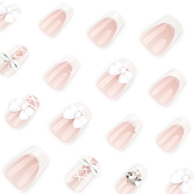 Artful Nail Art with Bows and Rhinestone Decorations Stornfield