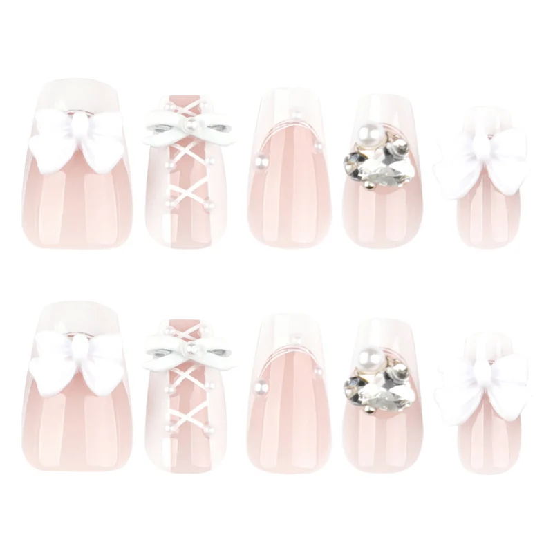 Artful Nail Art with Bows and Rhinestone Decorations Stornfield