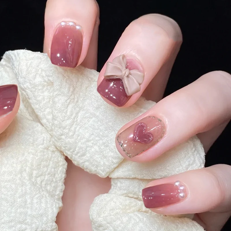 Artful Nail Art with Bow and Heart Design Stornfield