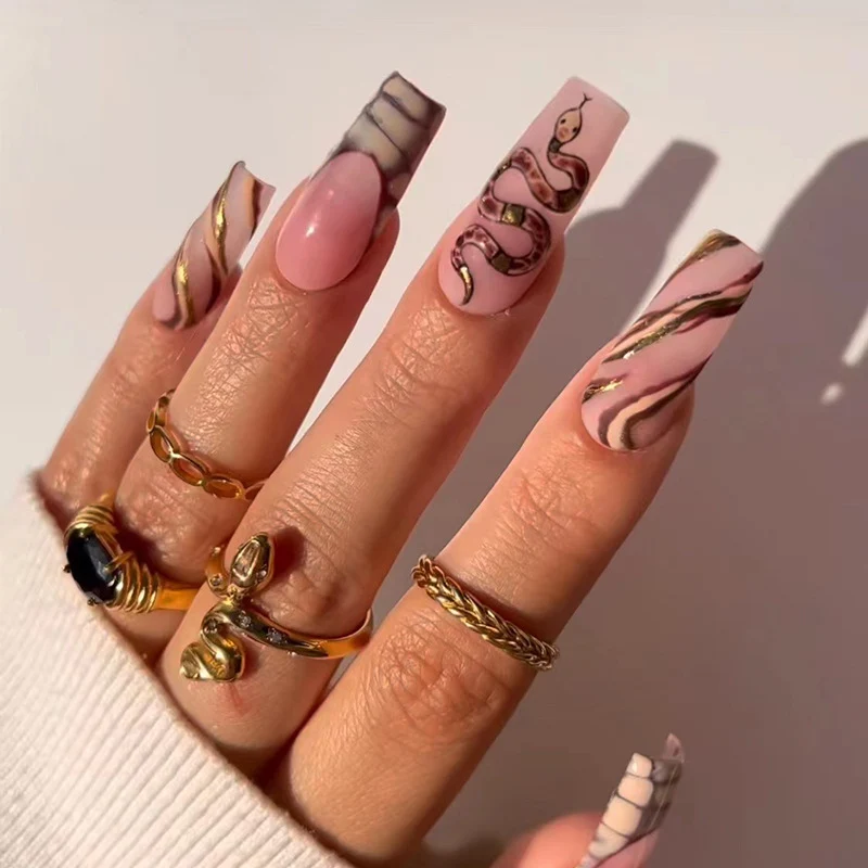 Artful Nail Art with Snake Design and Metallic Elements Stornfield