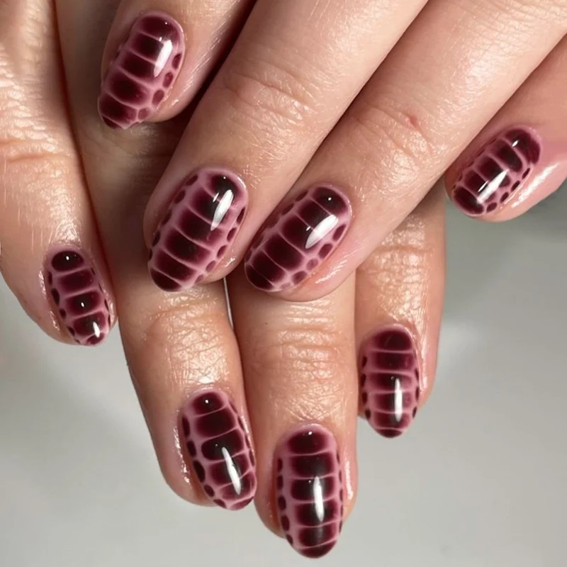 Artful nail art with snake motif Stornfield