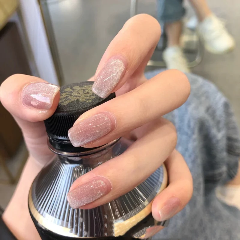 Artful nail art with a gentle glitter effect and elegant finish Stornfield