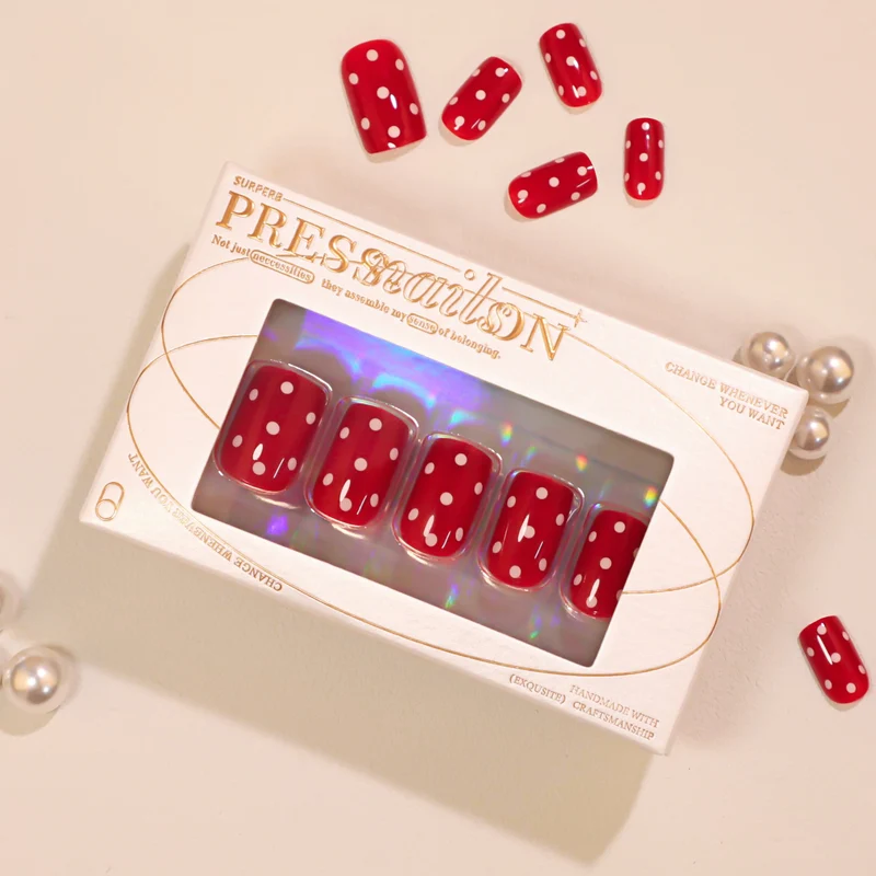 Artful Nail Art with Red Dots Stornfield