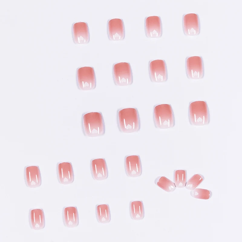 Artful nail art with heart-shaped accents and gentle ombre effect Stornfield