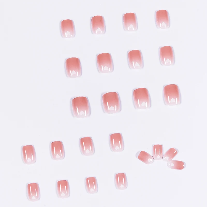 Artful nail art with heart-shaped accents and gentle ombre effect Stornfield