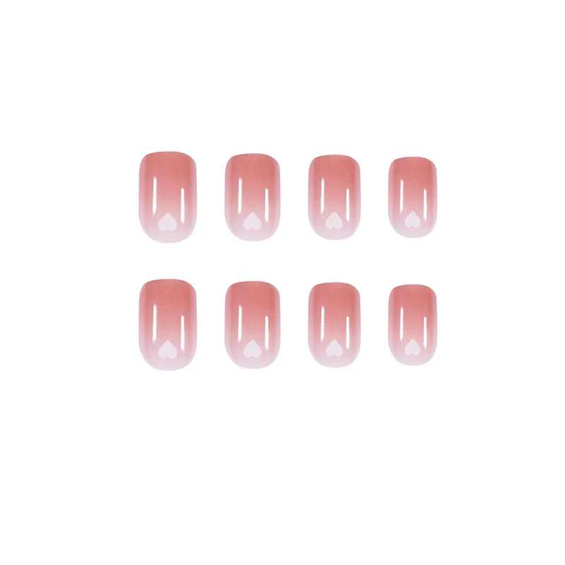 Artful nail art with heart-shaped accents and gentle ombre effect Stornfield