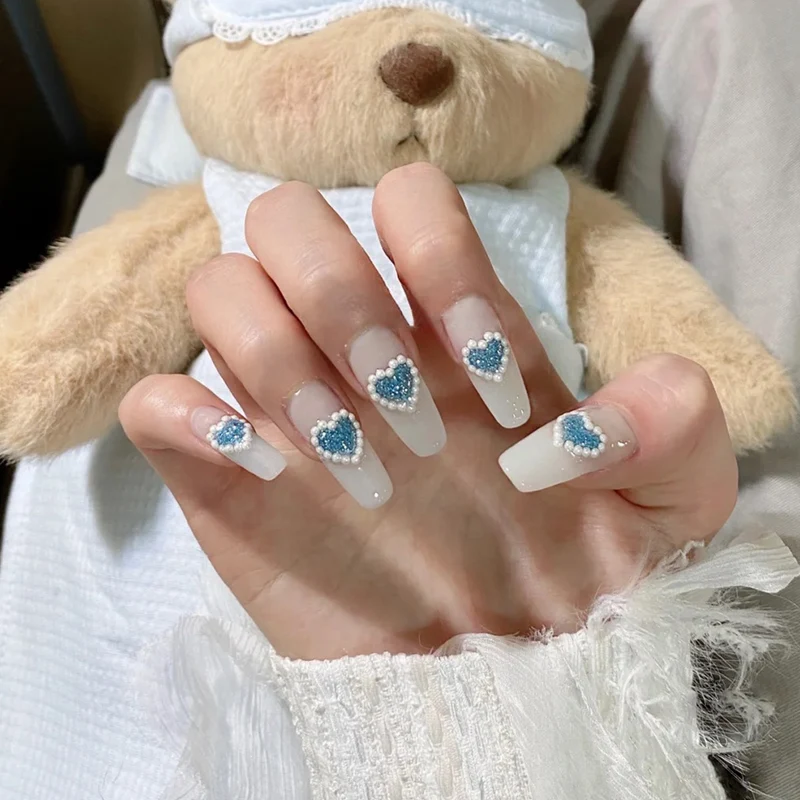 Artful nail art with heart-shaped accents Stornfield