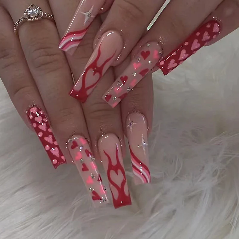 Artful Nail Art with Hearts and Glitter Accents Stornfield