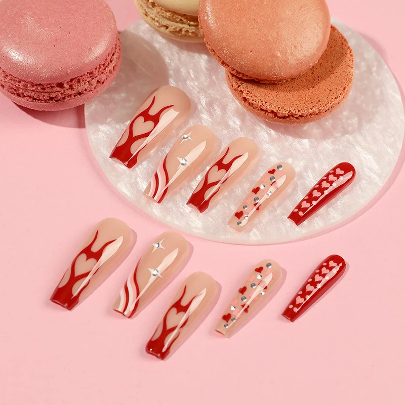 Artful Nail Art with Hearts and Glitter Accents Stornfield