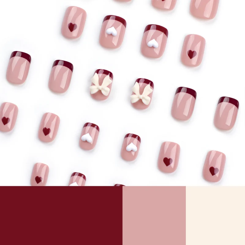 Artful nail art with heart and bow motifs Stornfield