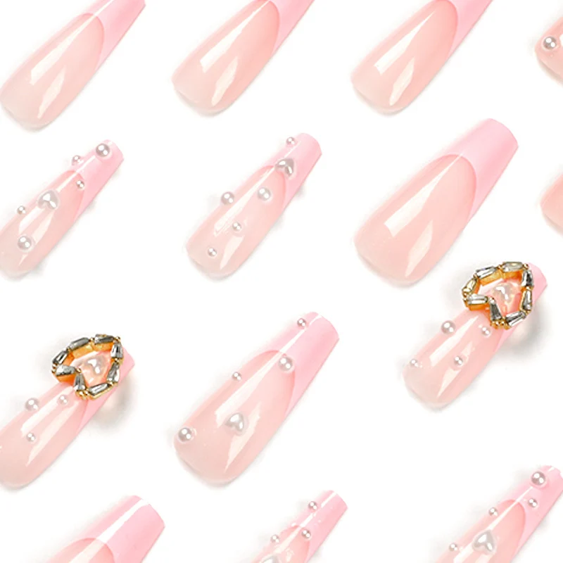 Artistic nail art with heart and pearl accents Stornfield