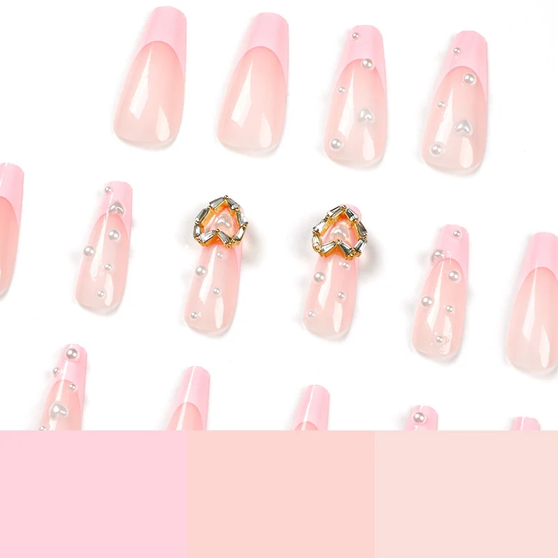 Artistic nail art with heart and pearl accents Stornfield