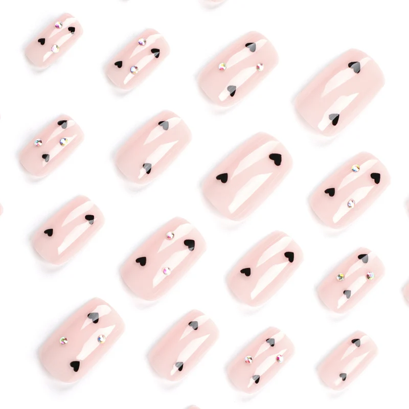 Artistic nail art with heart design and glitter accents Stornfield