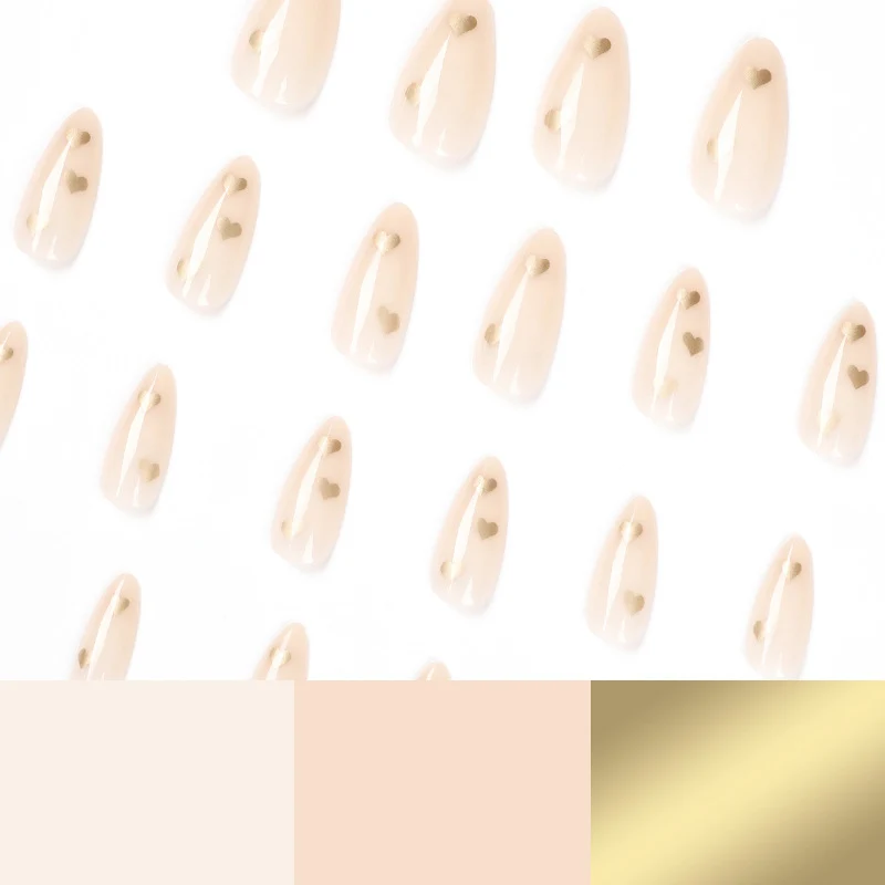 Artful Nail Art with Golden Heart Accents Stornfield