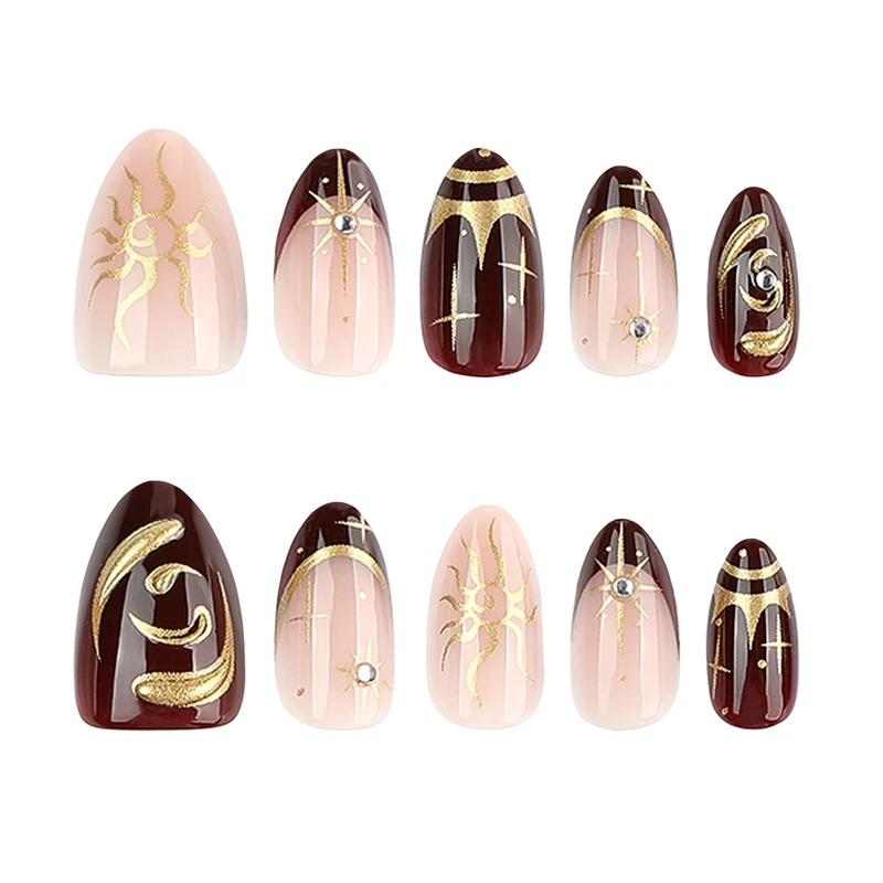 Artful nail art with golden accents and mystical motifs Stornfield