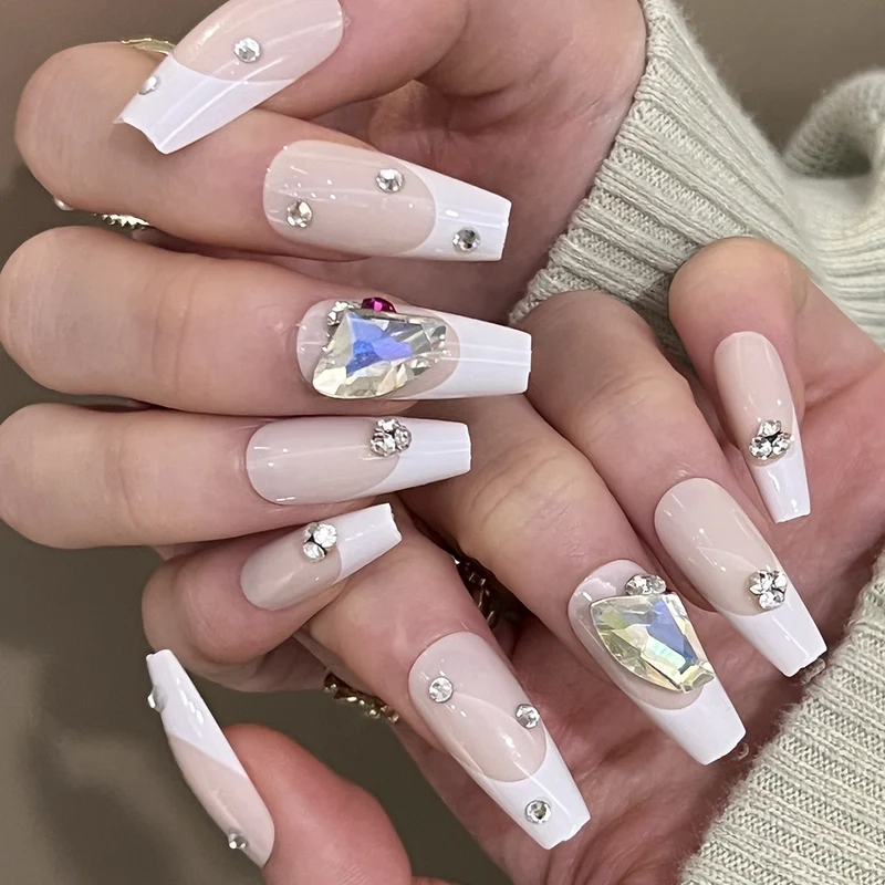 Artistic nail art with glitter accents and rhinestone embellishments Stornfield