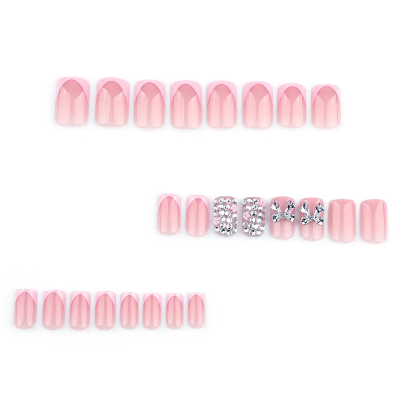 Artful nail art with glitter accents and bow decoration Stornfield