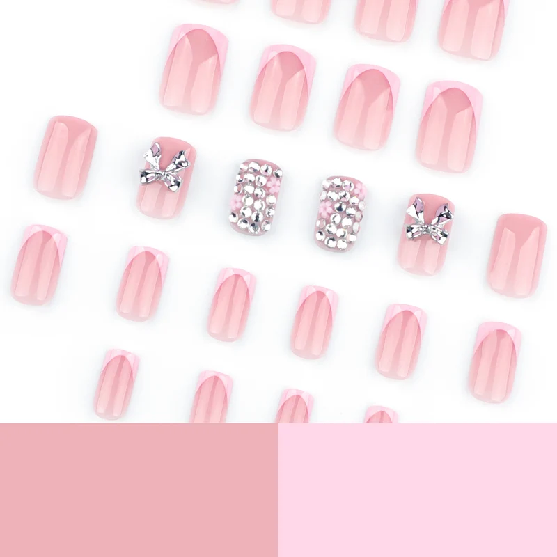 Artful nail art with glitter accents and bow decoration Stornfield