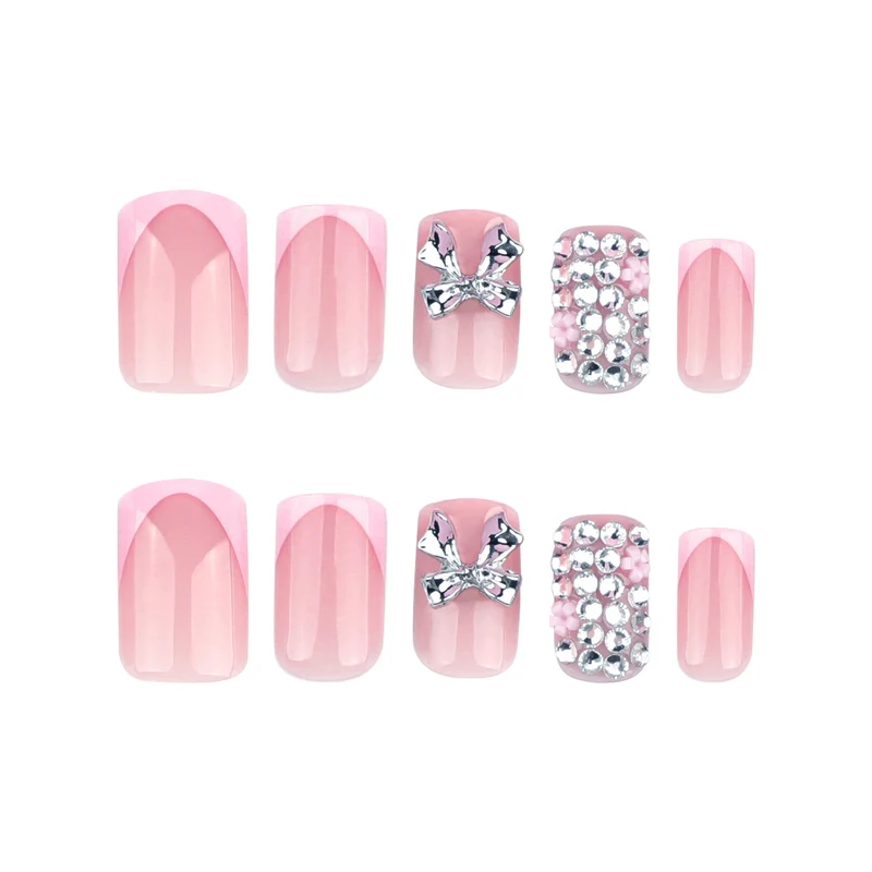 Artful nail art with glitter accents and bow decoration Stornfield