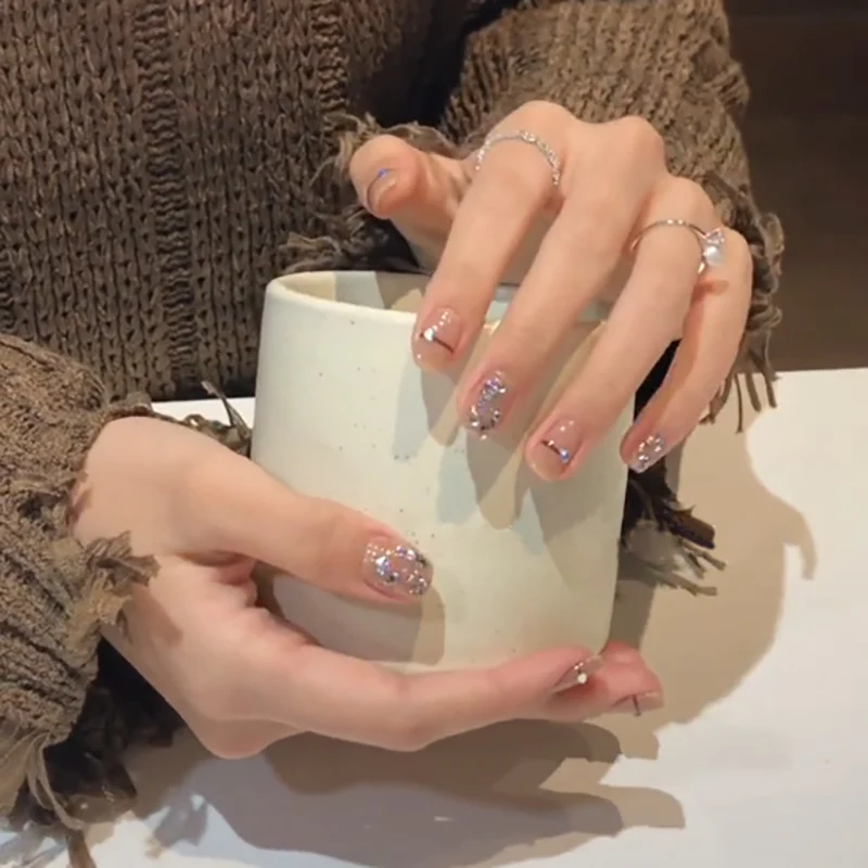 Artful Nail Art with Glitter Accents and Elegant Details Stornfield