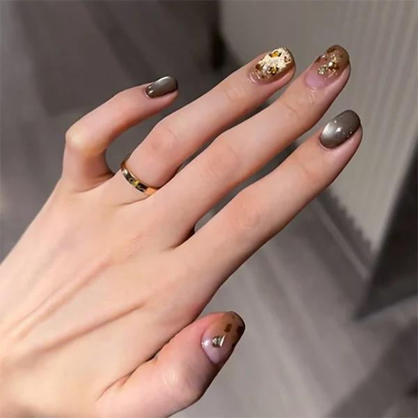 Artistic nail art with glitter accents and elegant design Stornfield