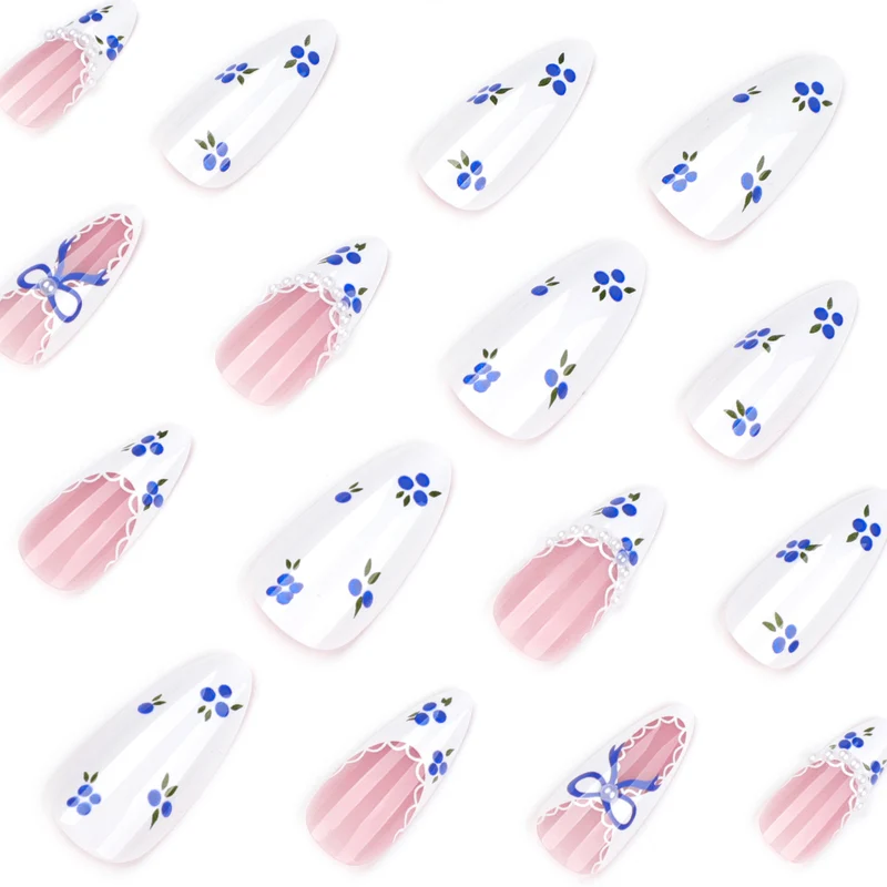Artful nail art with floral accents and bow embellishment Stornfield