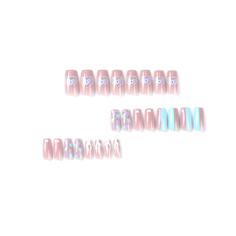 Artful nail art with floral accents and glitter embellishments Stornfield