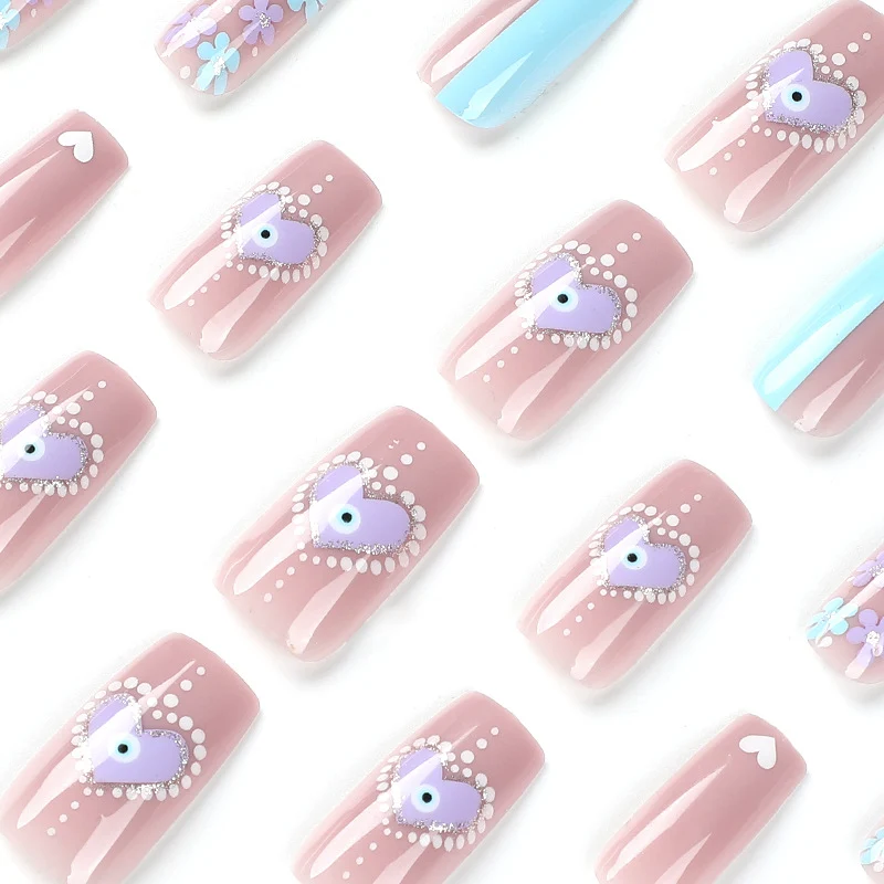 Artful nail art with floral accents and glitter embellishments Stornfield