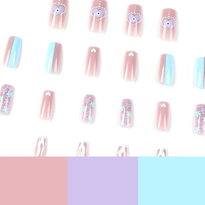 Artful nail art with floral accents and glitter embellishments Stornfield