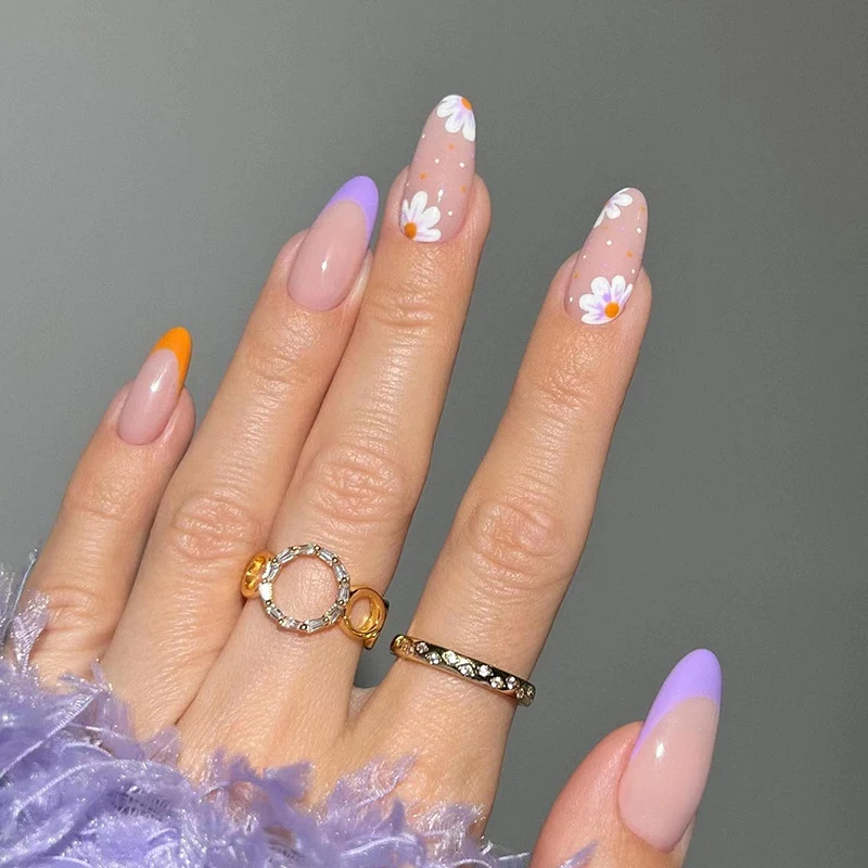Artful nail art with floral accents and gradient colors Stornfield