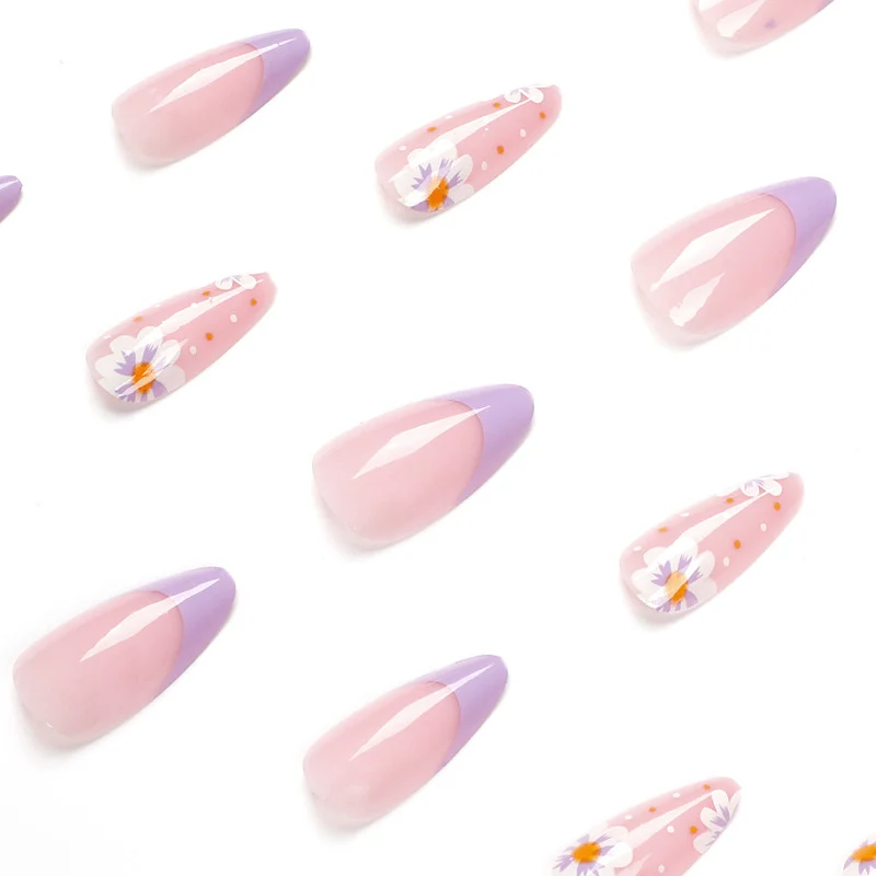 Artful nail art with floral accents and gradient colors Stornfield