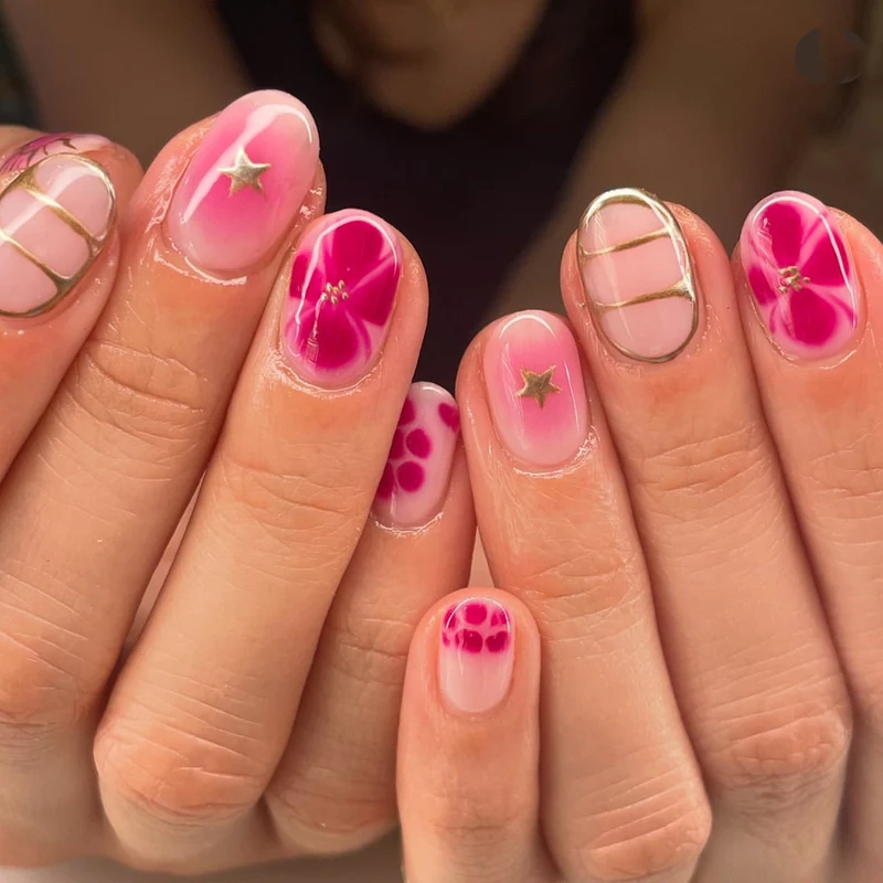 Artful Nail Art with Floral Design and Glitter Elements Stornfield