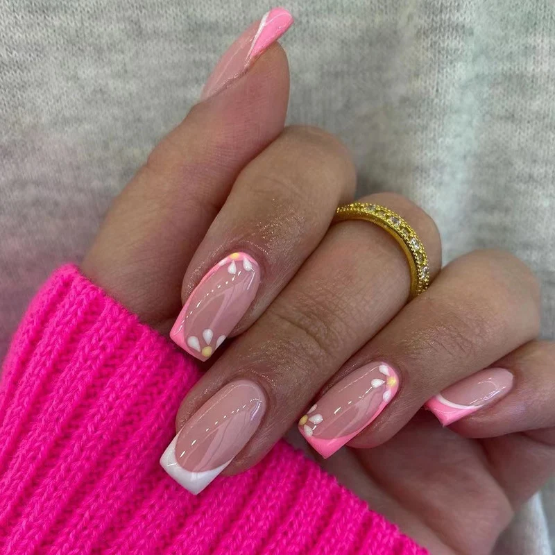 Artistic nail art with floral design and glitter accents Stornfield