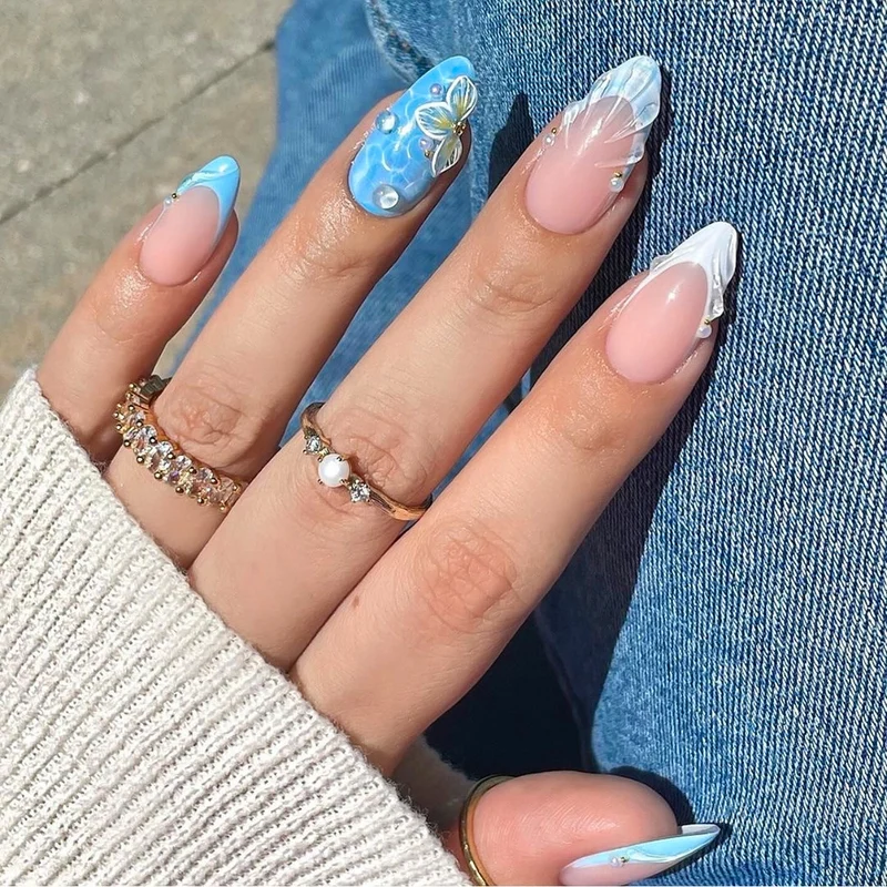 Artistic nail art with floral design and glitter Stornfield