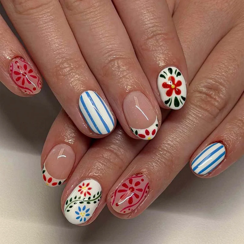 Artful nail art with floral design and colorful patterns Stornfield