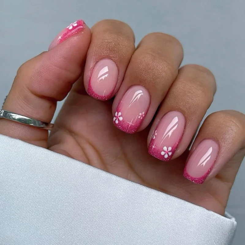 Artistic nail art with floral accent and glitter Stornfield