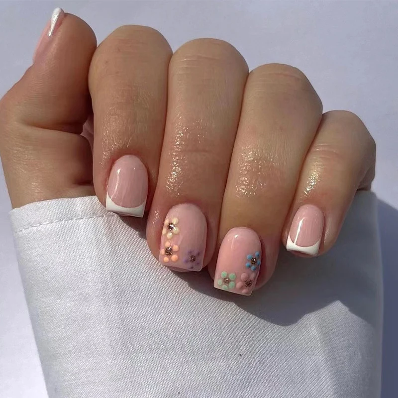 Artistic nail art with floral accent and elegant French tip Stornfield