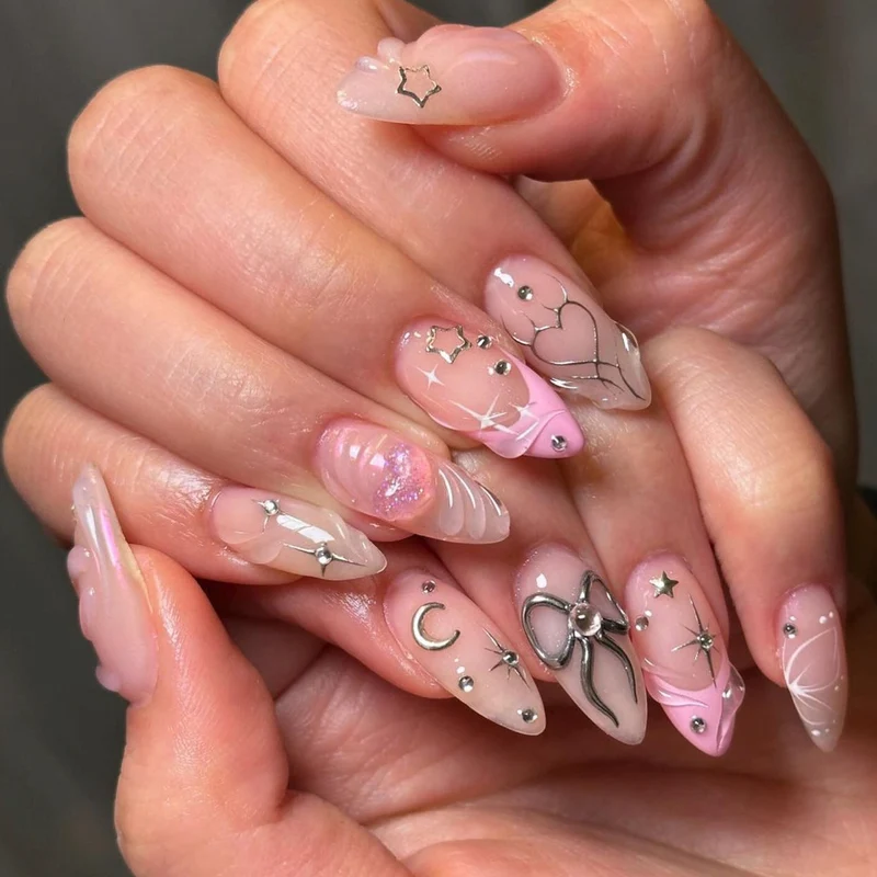 Artful nail art with filigree designs and glitter accents Stornfield