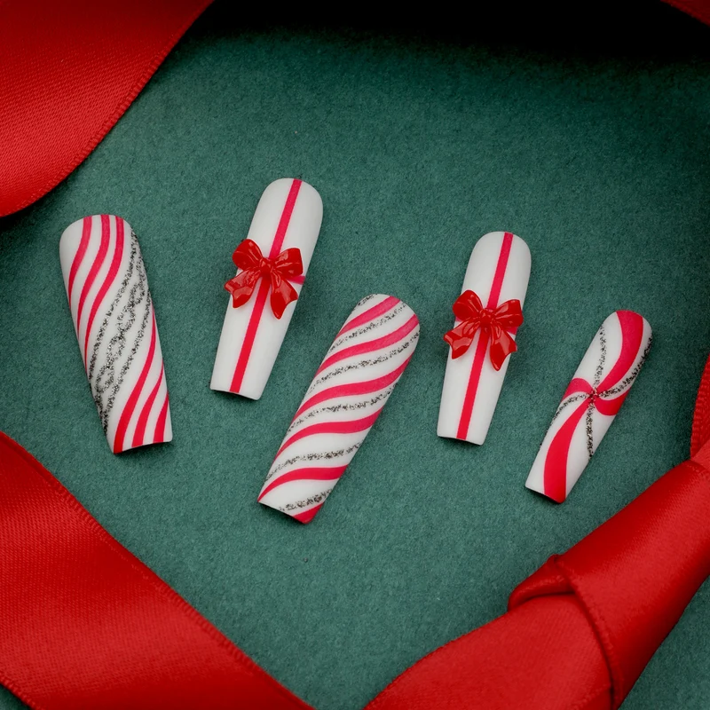 Artful Nail Art with Festive Bows and Christmas Motifs Stornfield